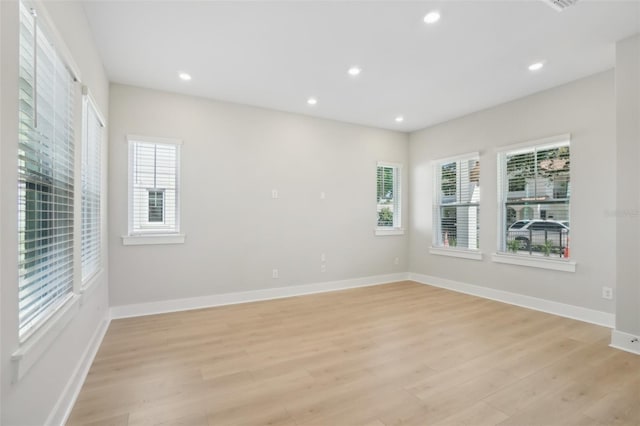 unfurnished room featuring light wood-type flooring