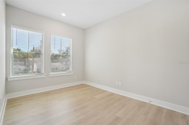 spare room with light wood-type flooring