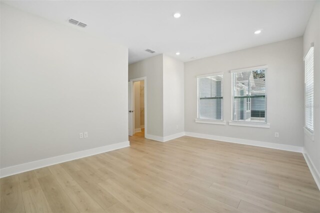 spare room with light hardwood / wood-style flooring