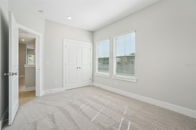 carpeted bedroom with a closet