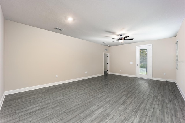 spare room with wood-type flooring and ceiling fan