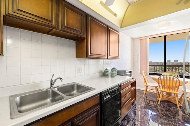 kitchen featuring tasteful backsplash, black dishwasher, and sink