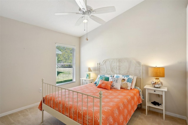 bedroom with ceiling fan, carpet flooring, and vaulted ceiling