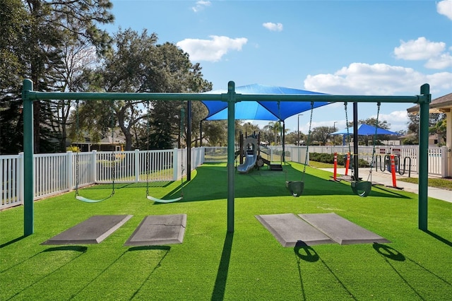 view of playground with a lawn