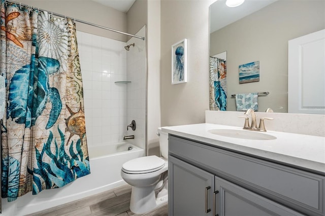 full bathroom with vanity, wood-type flooring, shower / bath combination with curtain, and toilet