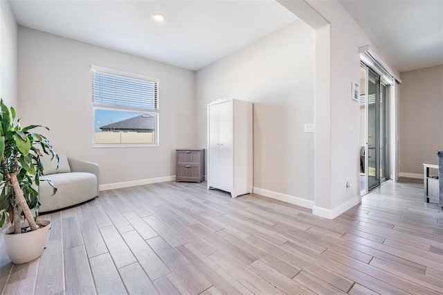 sitting room featuring light hardwood / wood-style floors