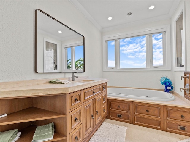 bathroom featuring vanity, ornamental molding, a washtub, and tile patterned floors