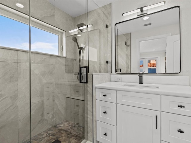 bathroom with vanity and an enclosed shower