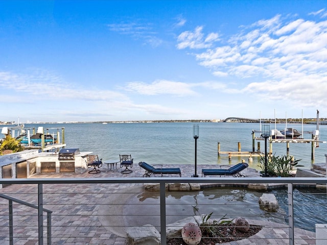 dock area with a water view