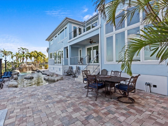 view of patio featuring a balcony and ceiling fan