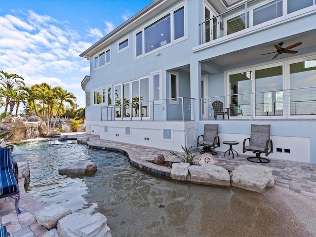 exterior space featuring a patio area and ceiling fan