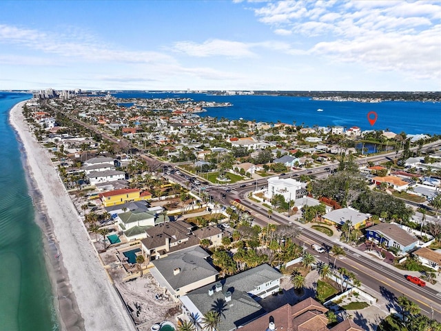 bird's eye view with a water view and a beach view