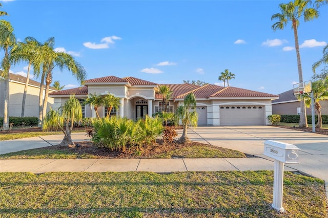 mediterranean / spanish-style house featuring a garage