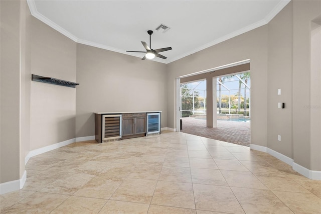 tiled spare room with ornamental molding, beverage cooler, and ceiling fan