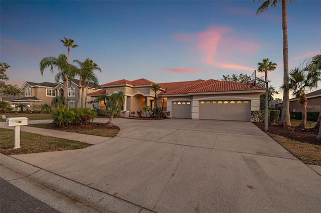 mediterranean / spanish-style home featuring a garage