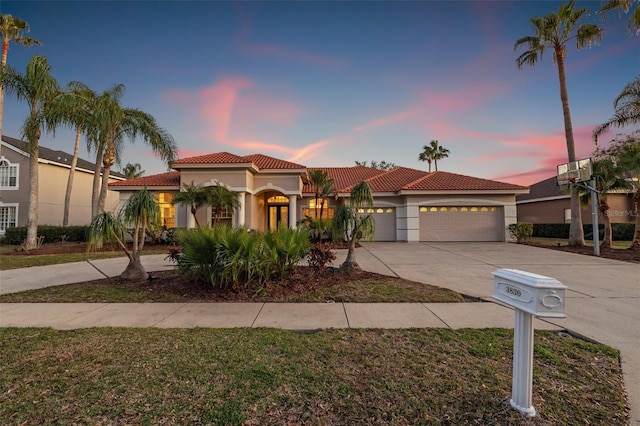 mediterranean / spanish house featuring a garage