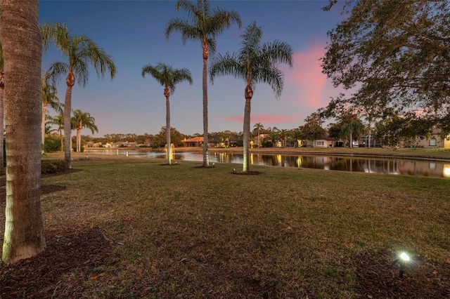 yard at dusk with a water view