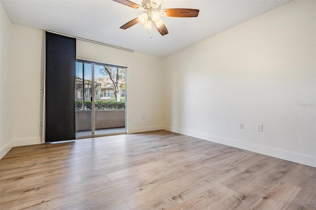 empty room featuring ceiling fan and light wood-type flooring