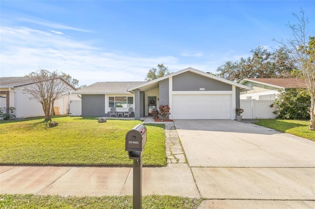 ranch-style house with a garage and a front lawn