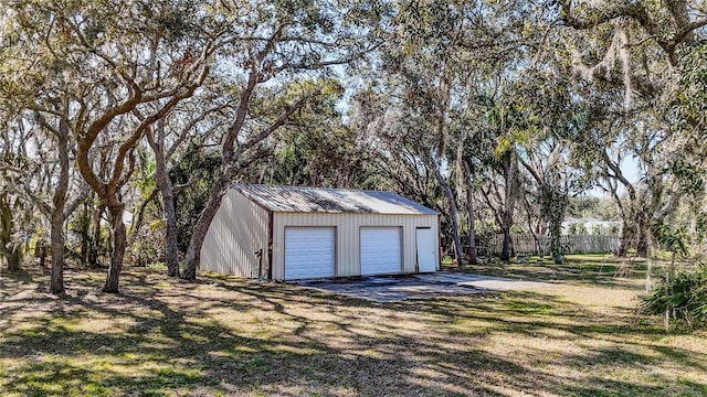 garage with a yard