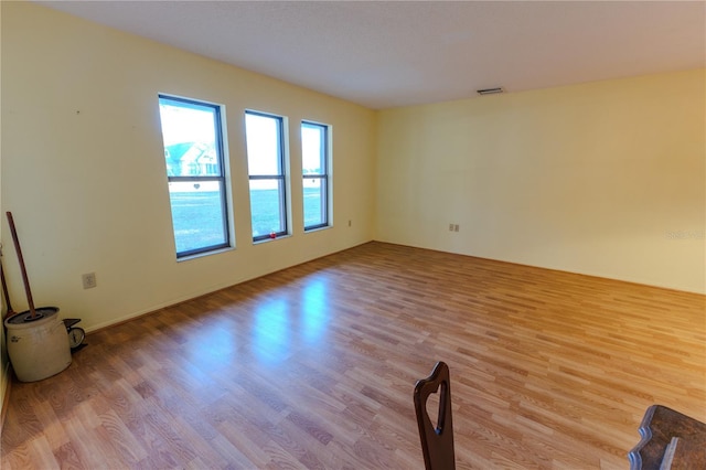 spare room with light wood-type flooring