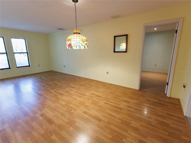 empty room featuring hardwood / wood-style flooring