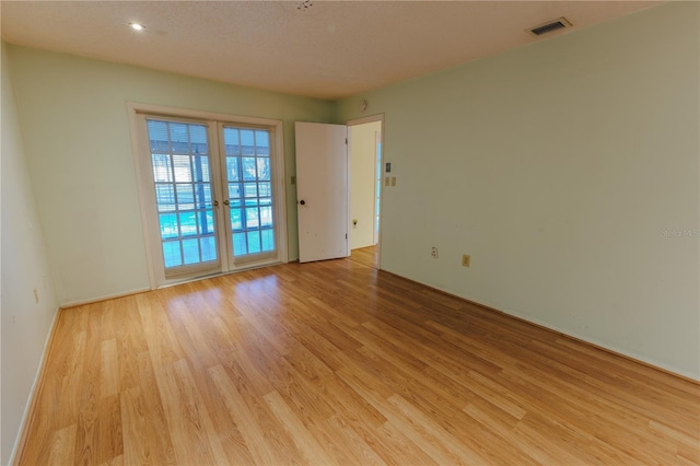 empty room with light wood-type flooring