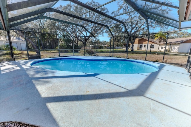 view of swimming pool with a lanai and a patio area