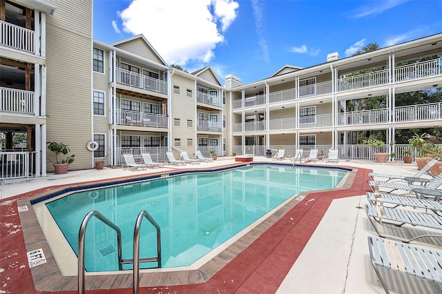 view of swimming pool with a patio area