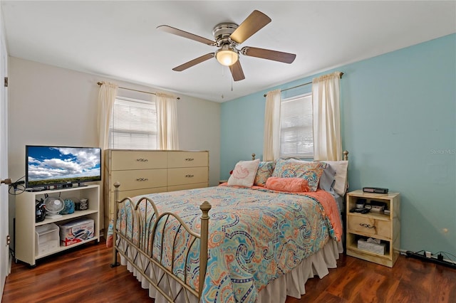 bedroom with dark wood-type flooring and ceiling fan