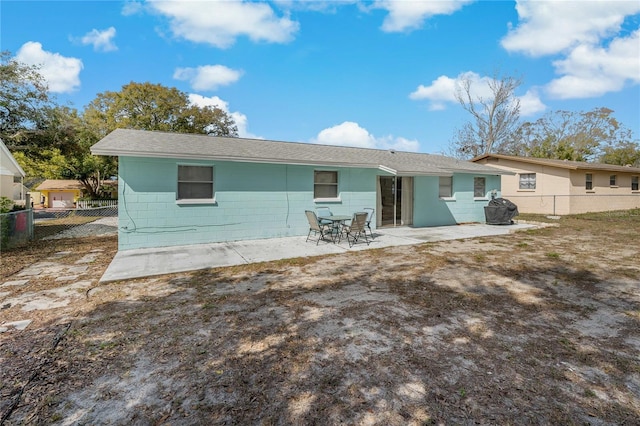 rear view of property featuring a patio