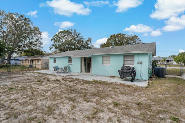 rear view of house featuring a patio