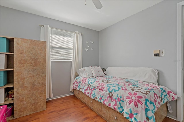 bedroom featuring ceiling fan and light wood-type flooring