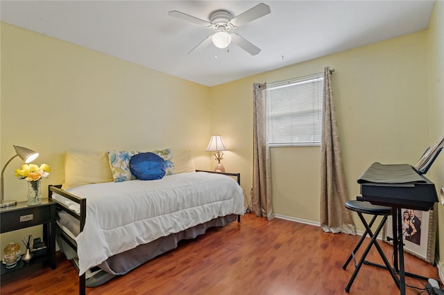 bedroom with ceiling fan and wood-type flooring