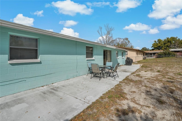 back of house with a patio