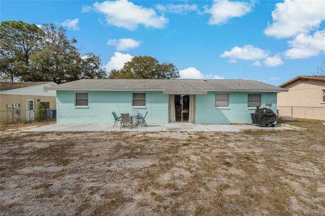 back of house with a patio area