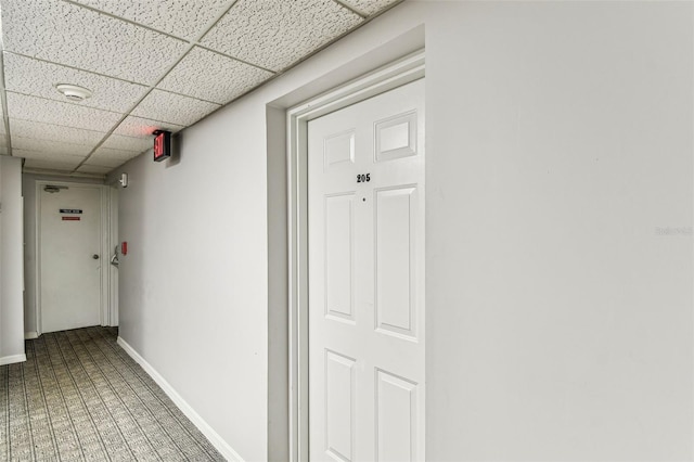 corridor featuring a paneled ceiling