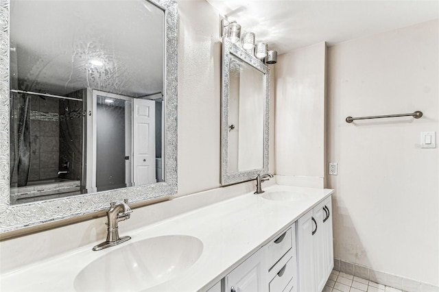 bathroom featuring vanity and tile patterned flooring