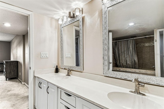 bathroom with vanity and a shower with shower curtain