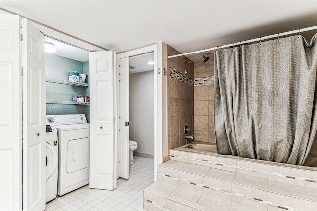 bathroom featuring shower / bathtub combination with curtain, tile patterned floors, washer and dryer, and toilet