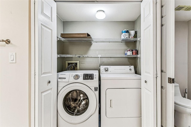 laundry area with washer and clothes dryer