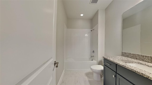 full bathroom with vanity, tiled shower / bath, and toilet