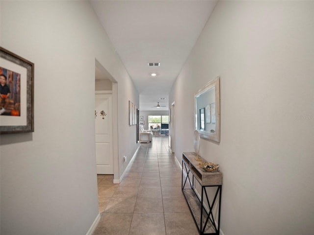 hallway with light tile patterned flooring