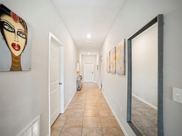 hallway featuring light tile patterned flooring