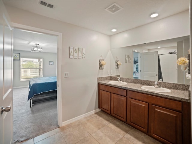 bathroom featuring tile patterned floors and vanity