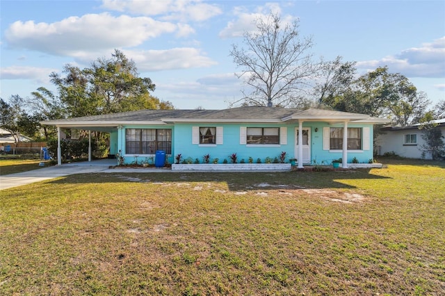 ranch-style house with a front yard and a carport