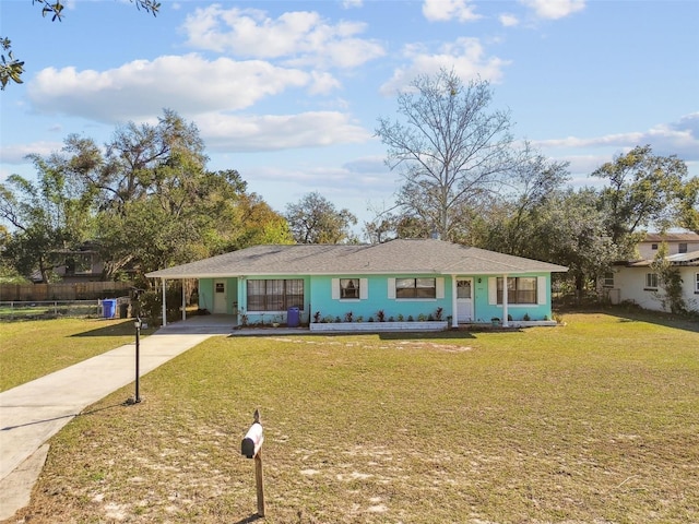 single story home featuring a carport and a front yard