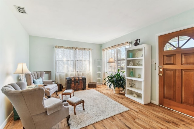 sitting room featuring light hardwood / wood-style flooring