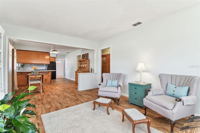 sitting room featuring light wood-type flooring