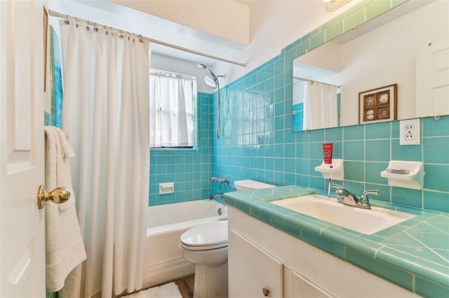 full bathroom with shower / tub combo with curtain, toilet, tile walls, vanity, and decorative backsplash